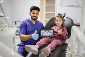 When should my child see a dentist?